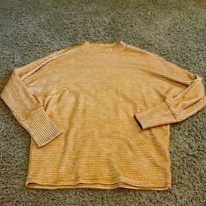 Turtle neck sweater with gold and white textured stripes